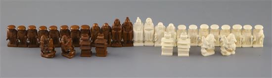 An unusual late 19th century Japanese brown stained and natural ivory figural chess set, kings 1.75in.